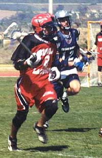 Junior Adam Kane brings the ball upfield - Photo by E.M. Connally